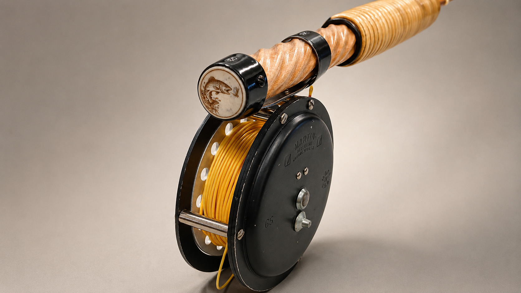 Custom engraved fly fishing rod with Martin reel and trout inlay